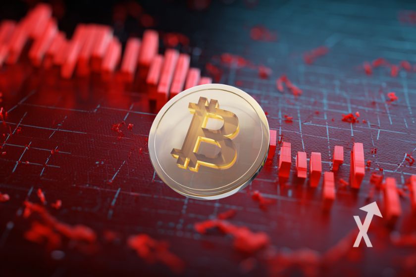 Bitcoin coin avec un fond rouge d'une graphique de prix qui chute