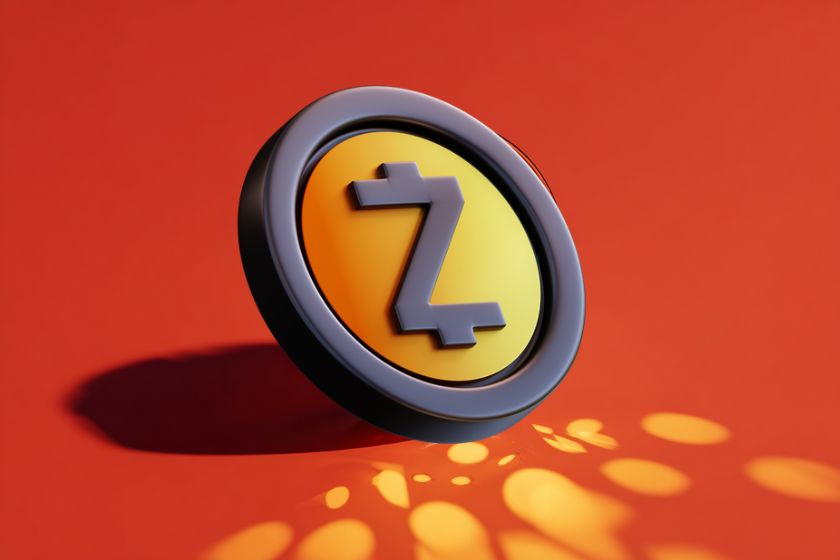 coin Zcash ZC sur un fond rouge avec des points de lumière jaunes