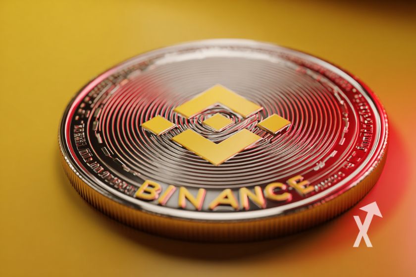 coin Binance posé sur un table jaune