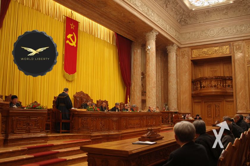 tribunal avec rideau jaune et juges et le jeton WLFI en haut à gauche