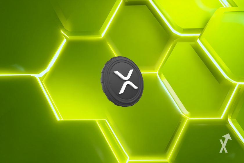 Le token gris de XRP sur un fond vert avec des formes futuristes